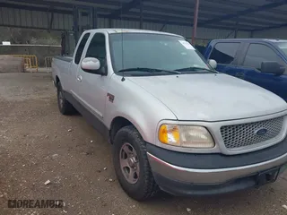 1999 Ford F-150 Work Series with VIN 1FTRX17W4XKA68691, listed as a IAAI auction lot 41703781 with 1 mi miles. Bid and sale history available at carsss.com. Image 1.