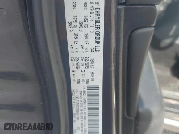 2014 Jeep Grand Cherokee Summit with VIN 1C4RJFJT4EC346946, listed as a Copart auction lot 60613025 with 50,565 mi miles and Salvage title. Bid and sale history available at DreamBid. Image 13.