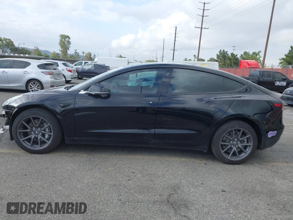 2019 Tesla Model 3 Mid Range with VIN 5YJ3E1EA3KF415601, listed as a IAAI auction lot 42125393 with 150,220 mi miles and . Bid and sale history available at carsss.com. Image 15.
