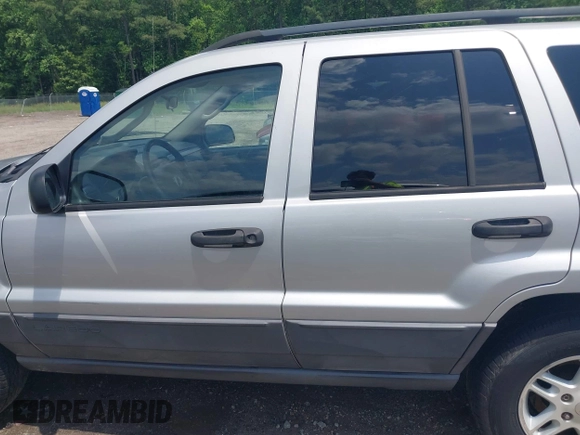 2004 Jeep Grand Cherokee Laredo with VIN 1J4GX48N04C435603, listed as a IAAI auction lot 42274197 with 256,163 mi miles and . Bid and sale history available at DreamBid. Image 14.