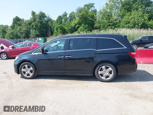 2011 Honda Odyssey Touring with VIN 5FNRL5H97BB073708, listed as a IAAI auction lot 42409164 with 141,986 mi miles and . Bid and sale history available at DreamBid. Image 14.