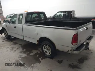 2002 Ford F-150 XL with VIN 1FTRX17W52NB23883, listed as a IAAI auction lot 41721680 with 144,115 mi miles. Bid and sale history available at carsss.com. Image 3.