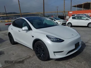 2021 Tesla Model Y Long Range with VIN 5YJYGDEE0MF069451, listed as a IAAI auction lot 41482649 with 55,542 mi miles. Bid and sale history available at carsss.com. Image 1.