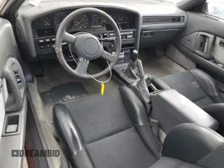 1987 Toyota Supra z VIN JT2MA71J4H0068594, wystawiony jako Copart lot #81918653 z przebiegiem 91 630 mil mil oraz Szkoda całkowita • Salvage title. Historia ofert i sprzedaży dostępna na DreamBid. Obrazek 8.