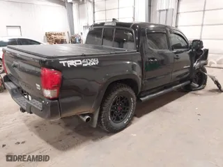 2016 Toyota Tacoma SR with VIN 3TMCZ5AN5GM027471, listed as a IAAI auction lot 41054774 with 74,864 mi miles. Bid and sale history available at carsss.com. Image 4.