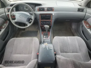 1998 Toyota Camry LE z VIN JT2BG22K6W0179063, wystawiony jako Copart lot #56998295 z przebiegiem 251 129 mil mil oraz Szkoda całkowita • Salvage title. Historia ofert i sprzedaży dostępna na DreamBid. Obrazek 8.