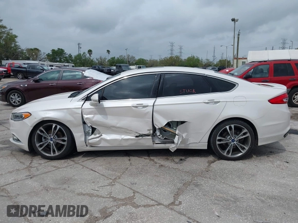 2017 Ford Fusion Titanium with VIN 3FA6P0K99HR272713, listed as a IAAI auction lot 41757334 with 104,733 mi miles. Bid and sale history available at carsss.com. Image 14.