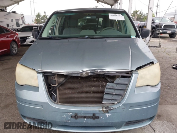 2008 Chrysler Town & Country LX with VIN 2A8HR44H38R831695, listed as a IAAI auction lot 42096656 with 254,424 mi miles and . Bid and sale history available at carsss.com. Image 6.