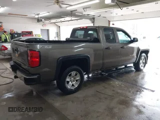 2014 Chevrolet Silverado 1500 LT with VIN 1GCVKREC5EZ147506, listed as a IAAI auction lot 41736960 with 112,399 mi miles and . Bid and sale history available at DreamBid. Image 4.