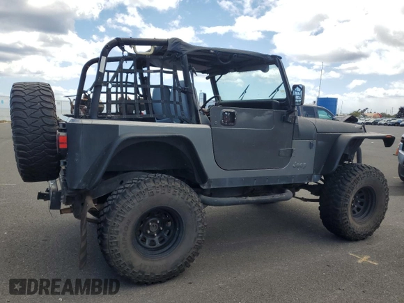 1990 Jeep Wrangler with VIN 2J4FY29T5LJ537896, listed as a Copart auction lot 57021295 with 143,753 mi miles and Clean title. Bid and sale history available at DreamBid. Image 3.