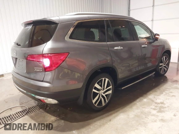 2017 Honda Pilot Touring with VIN 5FNYF6H91HB084737, listed as a IAAI auction lot 41608145 with 86,696 mi miles. Bid and sale history available at carsss.com. Image 4.