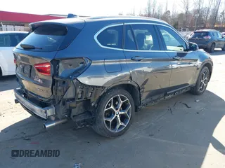 2018 BMW X1 xDrive28i z VIN WBXHT3C31J3H31737, wystawiony jako IAAI lot #41698670 z przebiegiem 68 017 mil mil oraz . Historia ofert i sprzedaży dostępna na DreamBid. Obrazek 18.