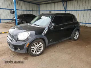 2014 MINI Countryman S with VIN WMWZC5C56EWP38065, listed as a Copart auction lot 59518395 with 91,106 mi miles and Salvage title. Bid and sale history available at DreamBid. Image 1.