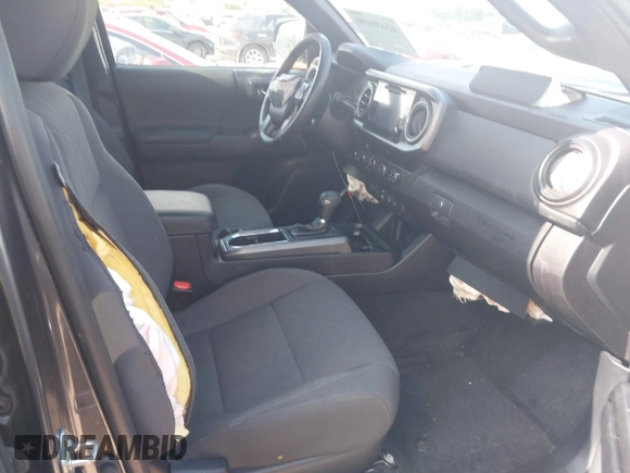 2018 Toyota Tacoma SR5 with VIN 3TMDZ5BN0JM051283, listed as a IAAI auction lot 42438690 with 106,155 mi miles and . Bid and sale history available at DreamBid. Image 5.