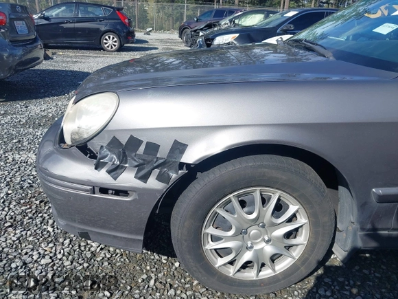 2004 Hyundai Sonata with VIN KMHWF25SX4A963868, listed as a IAAI auction lot 41973317 with 191,843 mi miles. Bid and sale history available at carsss.com. Image 6.