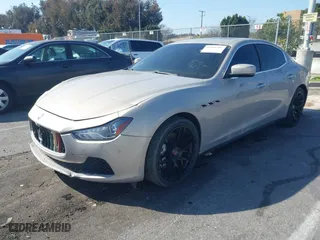 2014 Maserati Ghibli S Q4 with VIN ZAM57RTA8E1095303, listed as a IAAI auction lot 41600587 with 98,215 mi miles. Bid and sale history available at carsss.com. Image 2.