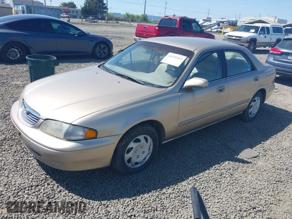 1999 Mazda 626 ES z VIN 1YVGF22C5X5811946, wystawiony jako IAAI lot #41970165 z przebiegiem 126 709 mil mil oraz . Historia ofert i sprzedaży dostępna na DreamBid. Obrazek 2.