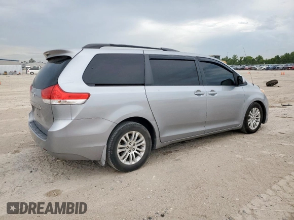 2013 Toyota Sienna XLE AAS with VIN 5TDYK3DC6DS291562, listed as a Copart auction lot 62411965 with 150,505 mi miles and Salvage title. Bid and sale history available at DreamBid. Image 3.