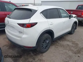 2021 Mazda CX-5 Touring with VIN JM3KFACM0M0412718, listed as a IAAI auction lot 41486753 with 41,496 mi miles. Bid and sale history available at carsss.com. Image 4.