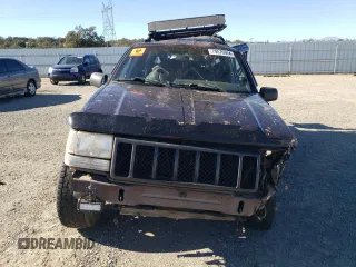 1997 Jeep Grand Cherokee Laredo with VIN 1J4GZ58Y3VC653093, listed as a Copart auction lot 79576964 with 0 mi miles and Salvage Title. Bid and sale history available at carsss.com. Image 5.