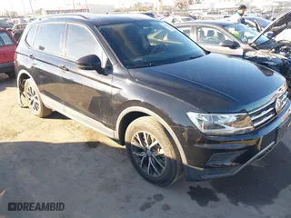 2021 Volkswagen Tiguan S with VIN 3VV1B7AX2MM051166, listed as a IAAI auction lot 41233878 with 28,690 mi miles. Bid and sale history available at carsss.com. Image 1.
