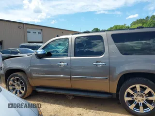 2011 Chevrolet Suburban LTZ with VIN 1GNSKKE3XBR394436, listed as a IAAI auction lot 42324225 with 132,871 mi miles and . Bid and sale history available at DreamBid. Image 14.