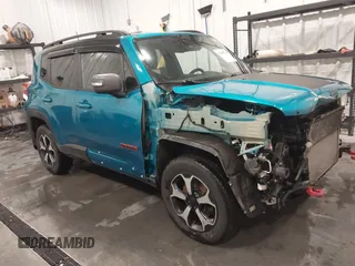 2021 Jeep Renegade Trailhawk z VIN ZACNJDC13MPM13834, wystawiony jako IAAI lot #41480700 z przebiegiem 62 621 mil mil oraz . Historia ofert i sprzedaży dostępna na DreamBid. Obrazek 1.