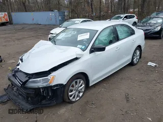2015 Volkswagen Jetta Sedan 1.8T SE with VIN 3VWD17AJXFM334862, listed as a IAAI auction lot 42039243 with 94,996 mi miles. Bid and sale history available at carsss.com. Image 2.
