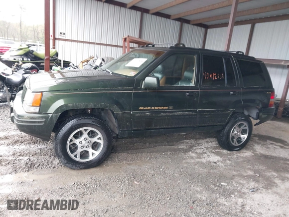 1997 Jeep Grand Cherokee Limited with VIN 1J4GZ78Y5VC723429, listed as a IAAI auction lot 42012836 with 231,126 mi miles. Bid and sale history available at carsss.com. Image 14.