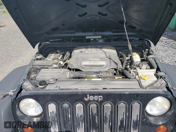 2012 Jeep Wrangler Sport with VIN 1C4AJWAG6CL256792, listed as a Copart auction lot 62634515 with 137,507 mi miles and Salvage title. Bid and sale history available at DreamBid. Image 12.