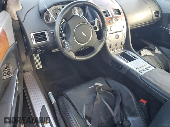 2005 Aston Martin DB9 z VIN SCFAD01A75GA02198, wystawiony jako Copart lot #75564554 z przebiegiem Nie podano mil oraz Nie do naprawy • Non repairable. Historia ofert i sprzedaży dostępna na DreamBid. Obrazek 8.