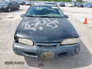 1995 Ford Thunderbird LX z VIN 1FALP62W7SH175725, wystawiony jako Copart lot #60622085 z przebiegiem 77 454 mil mil oraz Czysty tytuł • Clean title. Historia ofert i sprzedaży dostępna na DreamBid. Obrazek 5.