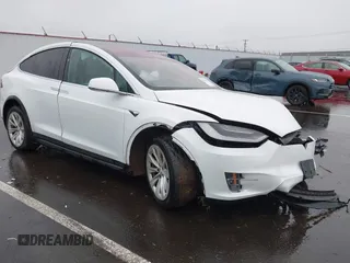 2019 Tesla Model X 75D with VIN 5YJXCBE22KF198905, listed as a IAAI auction lot 41221320 with 216,737 mi miles. Bid and sale history available at carsss.com. Image 1.