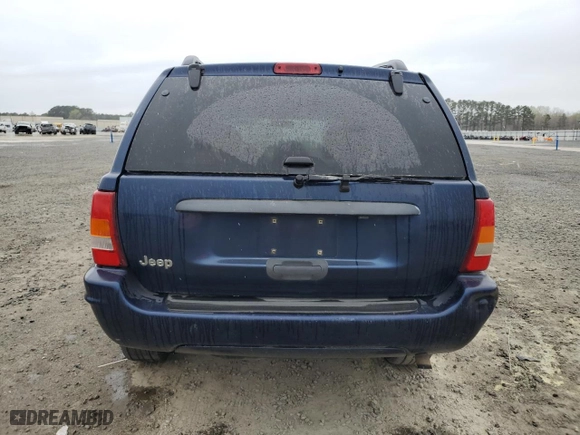2004 Jeep Grand Cherokee Laredo with VIN 1J4GX48S64C165105, listed as a Copart auction lot 50301455 with 299,686 mi miles and Salvage Title. Bid and sale history available at carsss.com. Image 6.