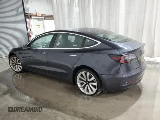 2018 Tesla Model 3 Long Range Battery z VIN 5YJ3E1EB2JF087126, wystawiony jako Copart lot #58263125 z przebiegiem 39 825 mil mil oraz Szkoda całkowita • Salvage title. Historia ofert i sprzedaży dostępna na DreamBid. Obrazek 2.