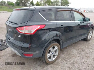 2014 Ford Escape SE with VIN 1FMCU9G96EUD61299, listed as a IAAI auction lot 42411069 with 147,957 mi miles and . Bid and sale history available at DreamBid. Image 4.