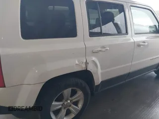 2014 Jeep Patriot Latitude with VIN 1C4NJPFA3ED618523, listed as a IAAI auction lot 41108657 with 124,035 mi miles and . Bid and sale history available at carsss.com. Image 6.