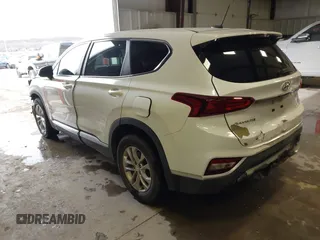 2019 Hyundai Santa Fe SE with VIN 5NMS23AD1KH063472, listed as a IAAI auction lot 41375650 with 64,496 mi miles and . Bid and sale history available at DreamBid. Image 3.