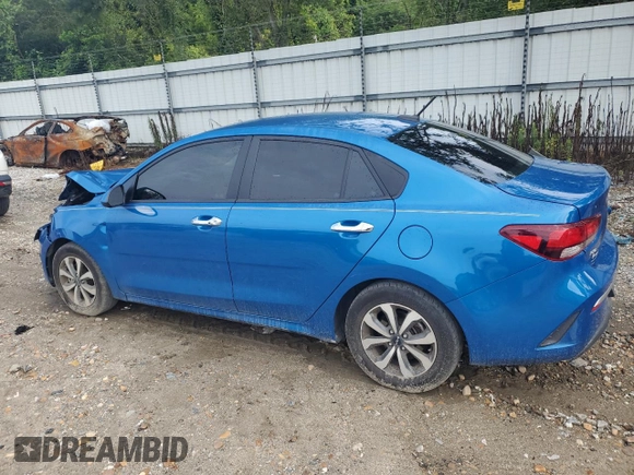 2023 Kia Rio S with VIN 3KPA24AD6PE548027, listed as a Copart auction lot 63697104 with 34,588 mi miles and Salvage Title. Bid and sale history available at carsss.com. Image 2.