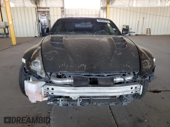 2009 Nissan 370Z z VIN JN1AZ44E19M411715, wystawiony jako Copart lot #56654815 z przebiegiem 123 791 mil mil oraz Szkoda całkowita • Salvage title. Historia ofert i sprzedaży dostępna na DreamBid. Obrazek 5.