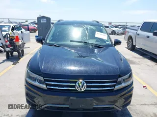 2021 Volkswagen Tiguan S with VIN 3VV1B7AX9MM067347, listed as a IAAI auction lot 42305101 with 77,042 mi miles and . Bid and sale history available at DreamBid. Image 12.