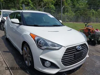 2013 Hyundai Veloster Turbo with VIN KMHTC6AE0DU137922, listed as a IAAI auction lot 42274225 with 125,102 mi miles and . Bid and sale history available at DreamBid. Image 1.