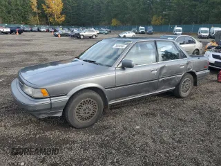 1988 Toyota Camry LE z VIN JT2SV22E0J0237998, wystawiony jako Copart lot #78850584 z przebiegiem 165 880 mil mil oraz Szkoda całkowita • Salvage title. Historia ofert i sprzedaży dostępna na DreamBid. Obrazek 1.
