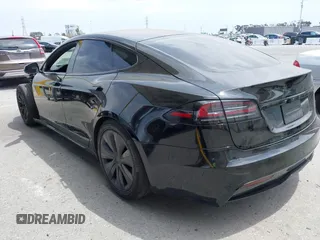 2023 Tesla Model S with VIN 5YJSA1E52PF528795, listed as a IAAI auction lot 42110660 with 21,243 mi miles and . Bid and sale history available at DreamBid. Image 3.