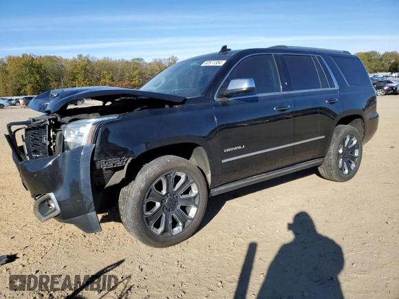 2018 GMC Yukon Denali with VIN 1GKS2CKJ3JR404177, listed as a Copart auction lot 82577354 with 129,744 mi miles and Salvage Title. Bid and sale history available at carsss.com. Image 1.