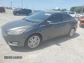 2017 Ford Focus Titanium z VIN 1FADP3J28HL347655, wystawiony jako Copart lot #62079835 z przebiegiem 129 983 mil mil oraz Szkoda całkowita • Salvage title. Historia ofert i sprzedaży dostępna na DreamBid. Obrazek 1.