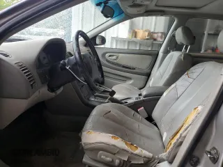 2001 Nissan Maxima SE z VIN JN1CA31A21T309782, wystawiony jako Copart lot #56696605 z przebiegiem 312 094 mil mil oraz Szkody całkowita. Historia ofert i sprzedaży dostępna na DreamBid. Obrazek 7.