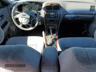 2005 Kia Optima LX z VIN KNAGD128055433689, wystawiony jako Copart lot #46909305 z przebiegiem 27 609 mil mil oraz Szkoda całkowita • Salvage title. Historia ofert i sprzedaży dostępna na DreamBid. Obrazek 8.