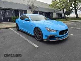 2014 Maserati Ghibli S Q4 with VIN ZAM57RTA7E1089301, listed as a Copart auction lot 65657825 with 61,058 mi miles and Salvage title. Bid and sale history available at DreamBid. Image 1.