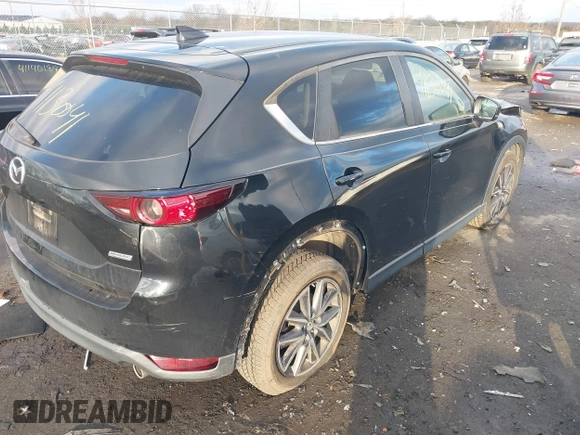 2018 Mazda CX-5 Touring z VIN JM3KFACM3J1435089, wystawiony jako IAAI lot #41130041 z przebiegiem 80 446 mil mil oraz . Historia ofert i sprzedaży dostępna na DreamBid. Obrazek 4.